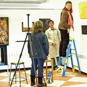 Reflectionist Group handing an art exhibit